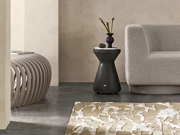 Blinde Design Solo Stool in natural concrete anchors private residence living room décor with minimalist modern seating appeal.