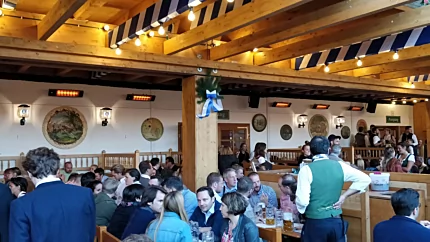 Heatscope Heaters Spot 2800W Radiant Heater wall-mounted in a commercial restaurant, electric infrared heating for diners.