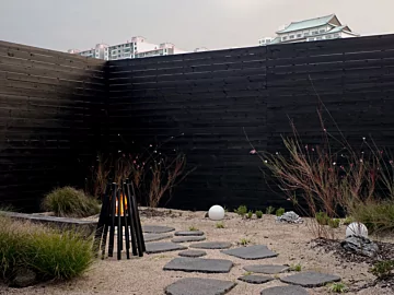 EcoSmart Fire Stix Fire Pit brings modern outdoor ambience to a private residence with clean-burning ethanol for stylish entertaining.