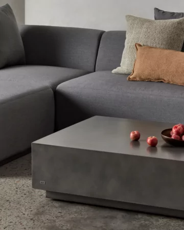 Blinde Design Bloc L6 concrete coffee table and Relax modular sofa create a stylish outdoor furniture lounge on a private patio.